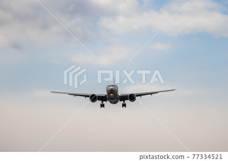 Passenger plane landing at Haneda Airport soon Passenger plane landing at Haneda Airport soon 77334521