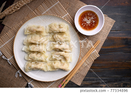 Steamed wonton dumpling stuffed with minced pork and shrimp  77334896