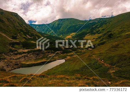 Alpine lake of the Carpathians Brebeneskul, the highest lake in Ukraine. 77336172