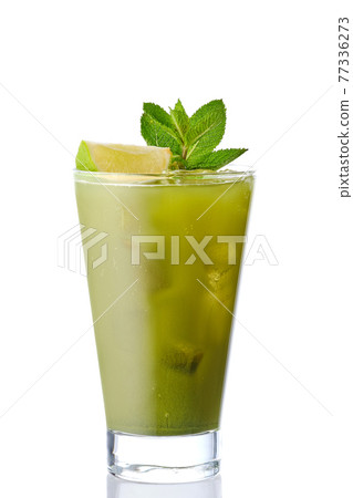 Cold refreshing lemonade with matcha tea, lime and mint isolated on white Cold refreshing lemonade with matcha tea, lime and mint isolated on white 77336273