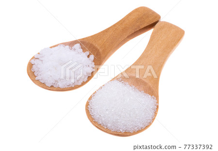 wooden spoon with salt isolated 77337392