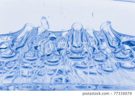 Glass medical ampoule vial for injection. Medicine is liquid sodium chloride with of aqueous solution in ampulla. Close up. Bottles ampule multicolor. Glass medical ampoule vial for injection. Medicine is liquid sodium chloride with of aqueous solution in ampulla. Close up. Bottles ampule multicolor. 77338079