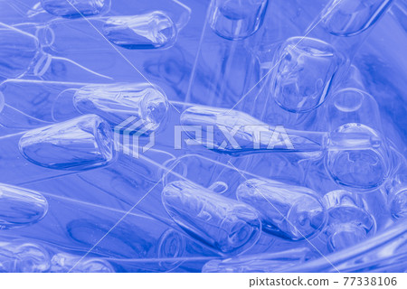 Glass medical ampoule vial for injection. Medicine is liquid sodium chloride with of aqueous solution in ampulla. Close up. Bottles ampule multicolor. Glass medical ampoule vial for injection. Medicine is liquid sodium chloride with of aqueous solution in ampulla. Close up. Bottles ampule multicolor. 77338106
