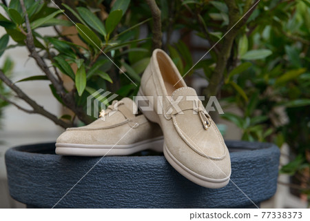 Woman's coral stylish suede loafer shoes. Pair of trendy female loafers shoes Woman's coral stylish suede loafer shoes. Pair of trendy female loafers shoes 77338373