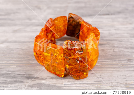 Bracelet of whole pieces of honey amber. Each element is turned and polished into manual Bracelet of whole pieces of honey amber. Each element is turned and polished into manual 77338919