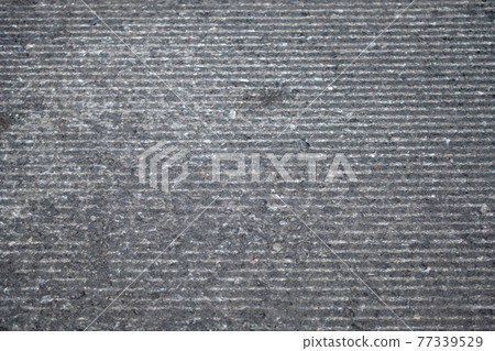 asphalt road in need of repair 77339529