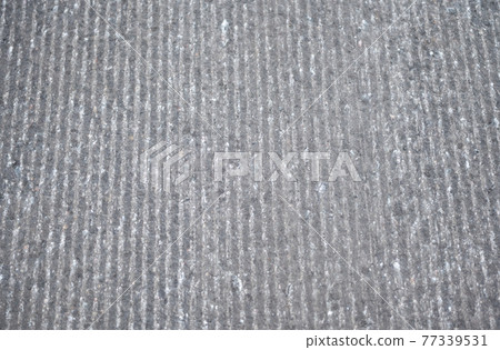 asphalt road in need of repair 77339531