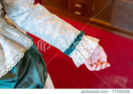 Photo of a woman in a retro dress Photo of a woman in a retro dress 77340298