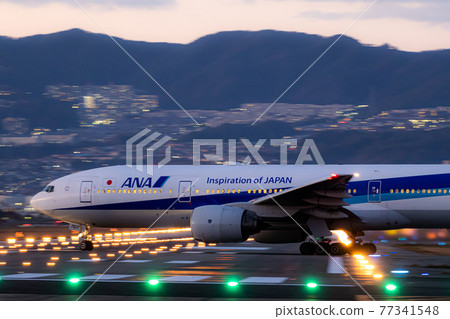 Passenger plane entering the runway at Osaka Airport 77341548