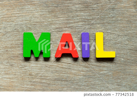 Color alphabet letter in word mail on wood background 77342518