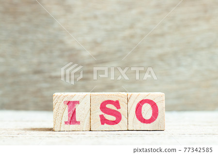 Alphabet letter block in word ISO on wood background Alphabet letter block in word ISO on wood background 77342585