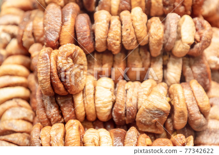 Dried figs in stacks for background (Selective focus) Dried figs in stacks for background (Selective focus) 77342622