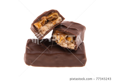 chocolate bar with nuts and caramel isolated 77343243