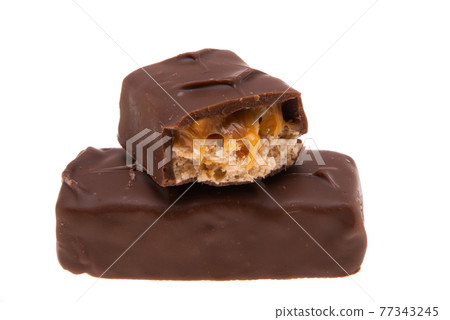 chocolate bar with nuts and caramel isolated 77343245