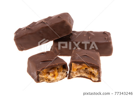 chocolate bar with nuts and caramel isolated 77343246