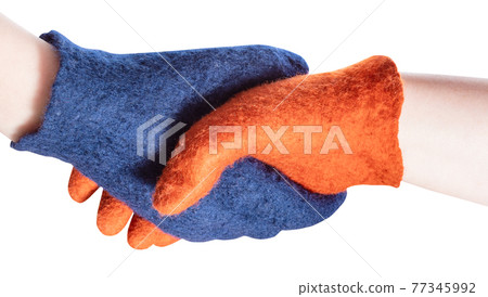 handshake of blue and orange gloved hands handshake of blue and orange gloved hands 77345992