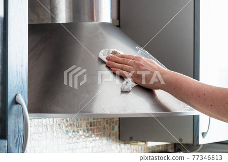 female hand washes stainless steel kitchen hood female hand washes stainless steel kitchen hood 77346813