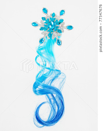 Children's decoration on a white background. A snowflake and a lock of hair. Children's decoration on a white background. A snowflake and a lock of hair. 77347676