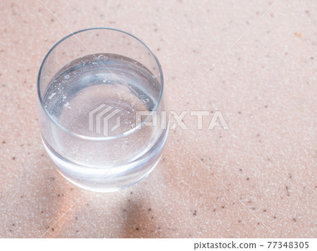 glass of water with treatment solution glass of water with treatment solution 77348305