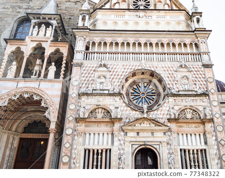 front view of Basilica porch and Cappella Colleoni 77348322