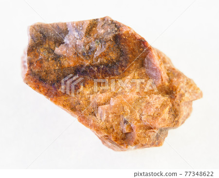 rough orthoclase stone on white 77348622