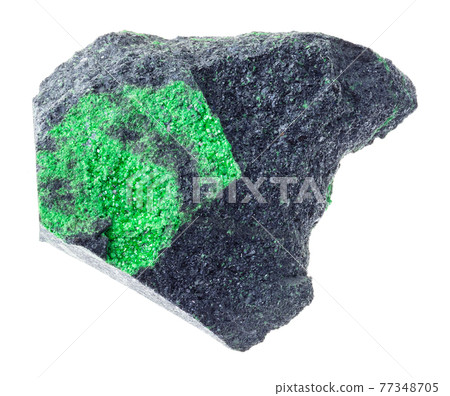 Uvarovite crystals on rough rock on white 77348705