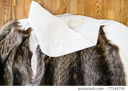 the coat layout with stitched fur pelts on table the coat layout with stitched fur pelts on table 77348795
