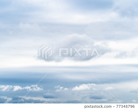 white clouds in gray sky on spring cloudy day white clouds in gray sky on spring cloudy day 77348796