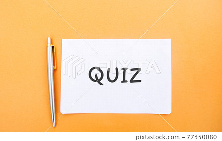 A note with the inscription Quiz and a pen. Business or education concept. Answers to oral or written questions from various fields of knowledge. A note with the inscription Quiz and a pen. Business or education concept. Answers to oral or written questions from various fields of knowledge. 77350080