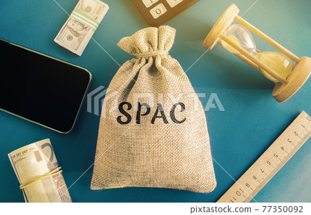 Money bag with the word SPAC - Special purpose acquisition company. Simplified listing of company, merger bypassing stock exchange IPO. Assessment of benefits and risks of investments 77350092