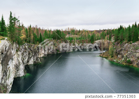 Marble canyon in Mining park Ruskeala at autumn Marble canyon in Mining park Ruskeala at autumn 77351303