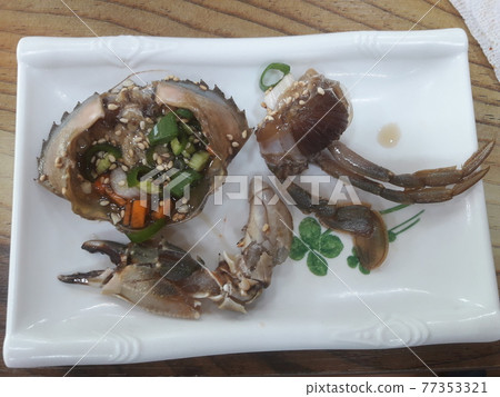 A plate of soy sauce marinated stone crab A plate of soy sauce marinated stone crab 77353321