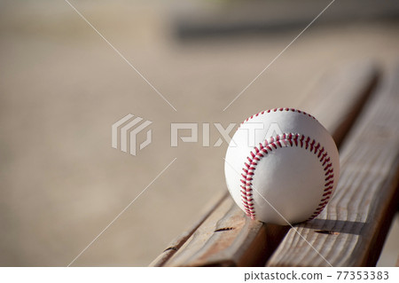 Ball on a wooden bench Ball on a wooden bench 77353383
