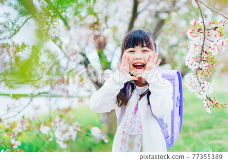 A little girl carrying a backpack and screaming 77355389