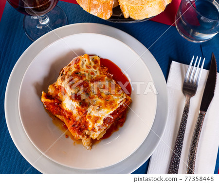 Lasagna a la Bolognese with bechamel sause 77358448