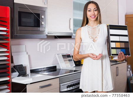 Woman offering artificial stone Woman offering artificial stone 77358463