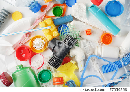 Colorful plastic garbage waste of the sea, rivers and lakes as a background Colorful plastic garbage waste of the sea, rivers and lakes as a background 77359268