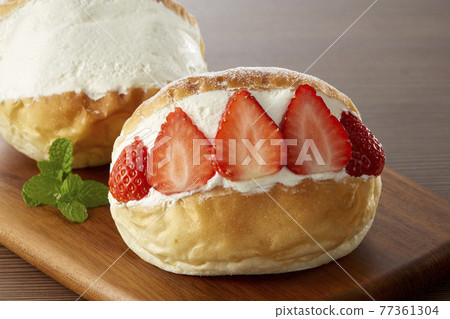 Italian-Roman traditional confectionery "Maritozzo" 77361304