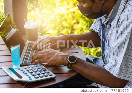 businessman sitting on desk work from home using laptop computer businessman sitting on desk work from home using laptop computer 77361925