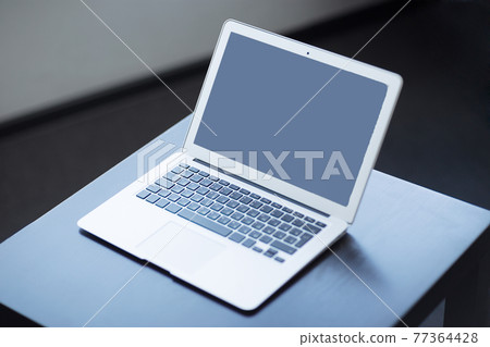 Stylish and classy, the laptop in the workplace. 77364428