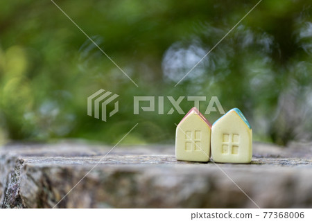 Two small cute pottery houses (fresh green background) Two small cute pottery houses (fresh green background) 77368006