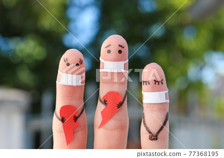 Fingers art of family in medical mask from COVID-2019. Concept of couple holding broken heart. 77368195
