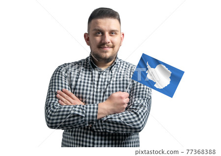 White guy holding a flag of Antarctica smiling confident with crossed arms isolated on a white background White guy holding a flag of Antarctica smiling confident with crossed arms isolated on a white background 77368388