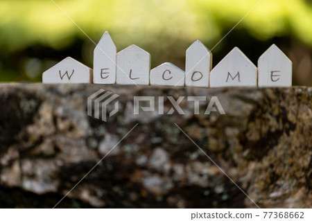 7 small wooden cute houses (fresh green background) 77368662