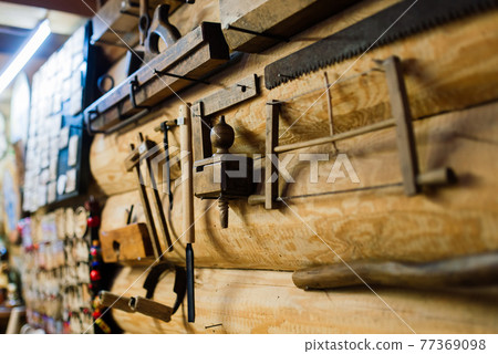 Ancient interior of a rural house in an ethnographic park. Old stove Ancient interior of a rural house in an ethnographic park. Old stove 77369098
