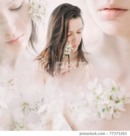 Young beautiful woman with flowers on white background. Tender pure portrait. Face skincare and health wellness, Natural makeup. Young beautiful woman with flowers on white background. Tender pure portrait. Face skincare and health wellness, Natural makeup. 77373263