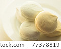 Delicious colored marshmallows with different flavors on a round plate 77378819