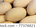 Elongated melon, fresh vegetables for sale 77378821