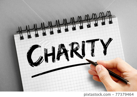 Charity text on notepad, concept background Charity text on notepad, concept background 77379464