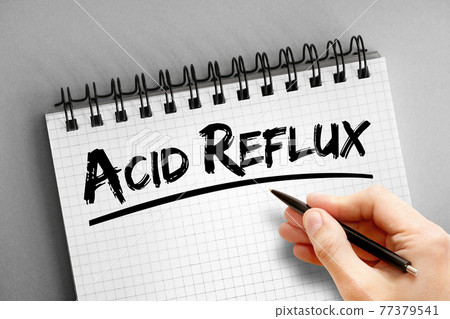 Acid reflux text on notepad, concept background Acid reflux text on notepad, concept background 77379541